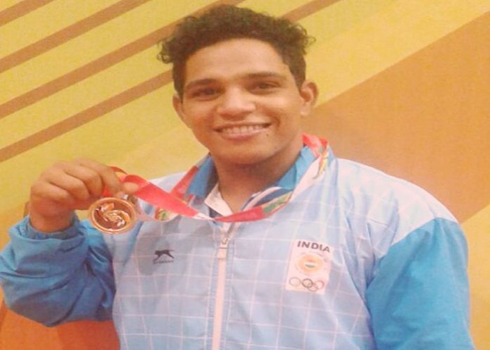 Ajay wins 13 medals the age 19 weight lifting